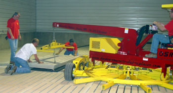 The Doeden Slat Replacer or DSR is shown here in the folded position.  This unique design allows the machine to enter a building through a standard walk in door opening.